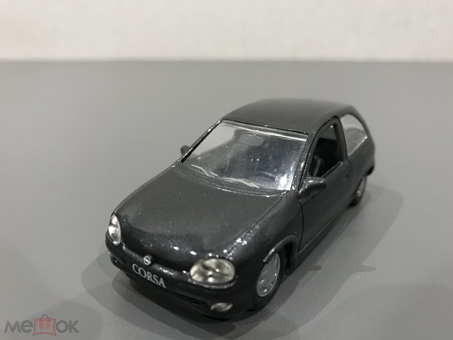 Gama 1005 модель авто Opel Corsa B хэтчбек 2-дверный темный графит масштаб  1:43 без коробки (торги завершены #283052854)